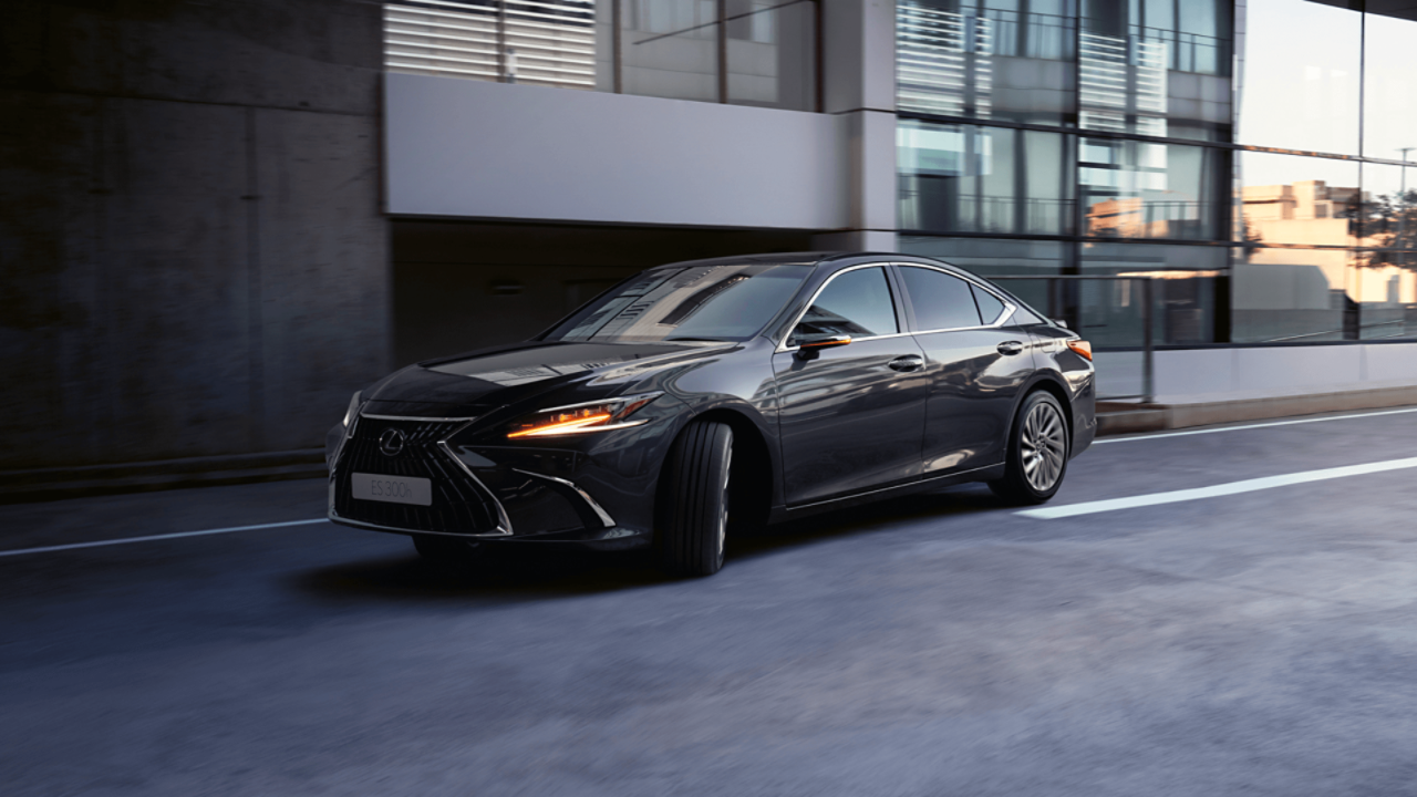 A Lexus ES 300h driving on a road