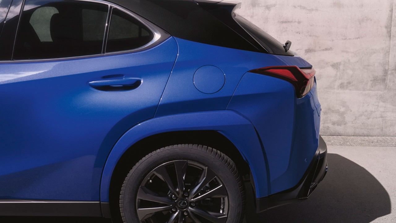 Side view of a blue Lexus UX